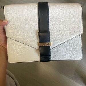Kate spade bag can be used as clutch or shoulder bag, white with black bow.